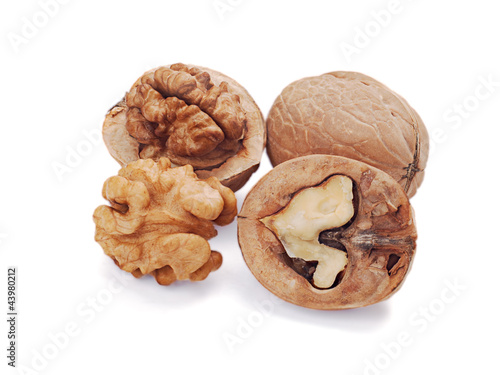 walnut and a cracked walnut isolated on the white background photo