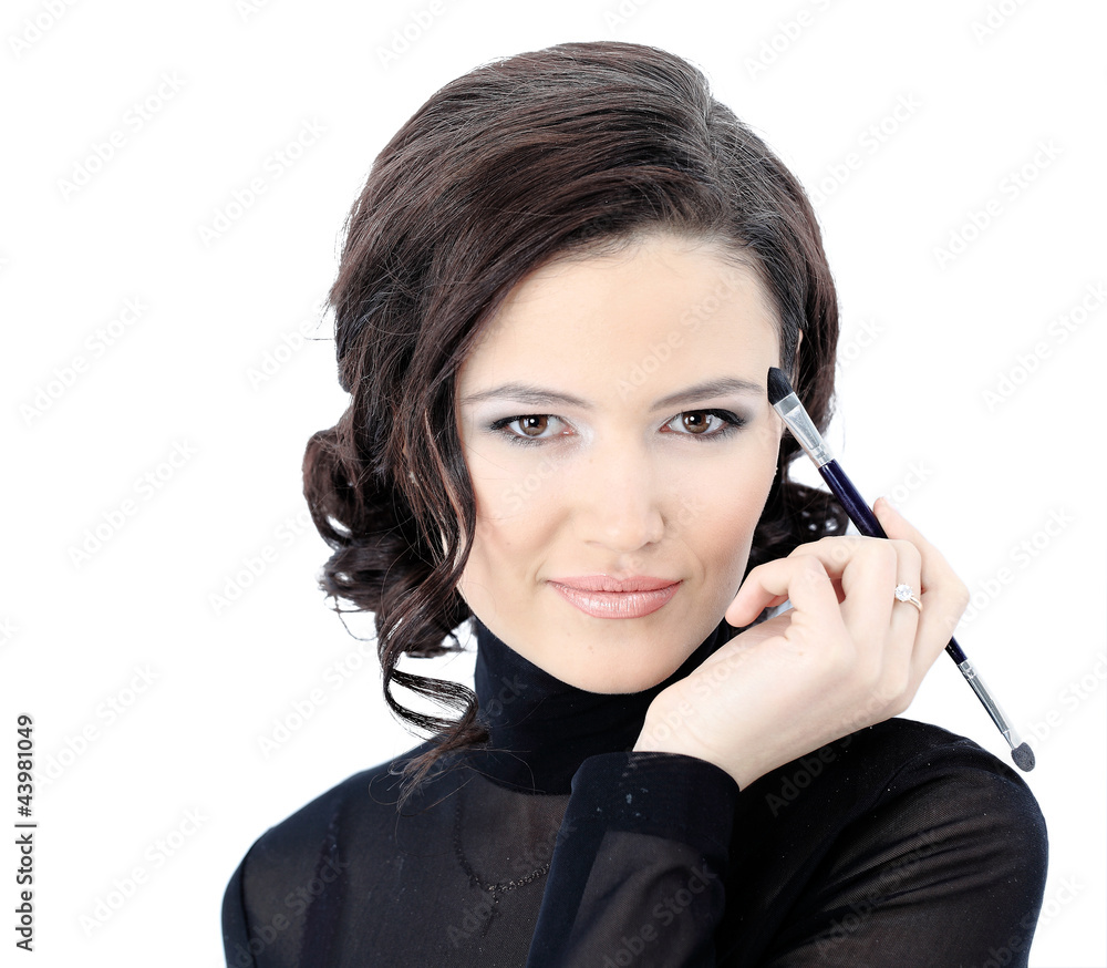 Beautiful woman with makeup brush near her face Beautiful woman with makeup brush near her face