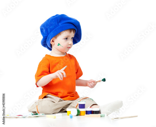 small artist child with paints