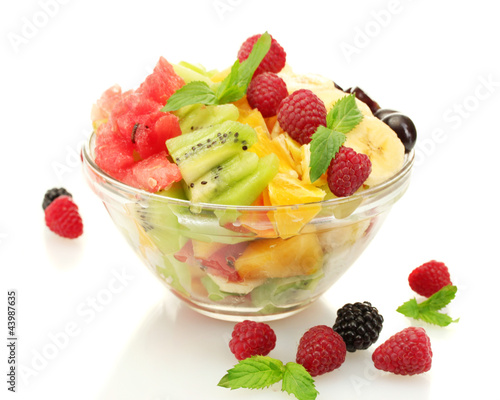 fresh fruits salad in bowl  and berries, isolated on white