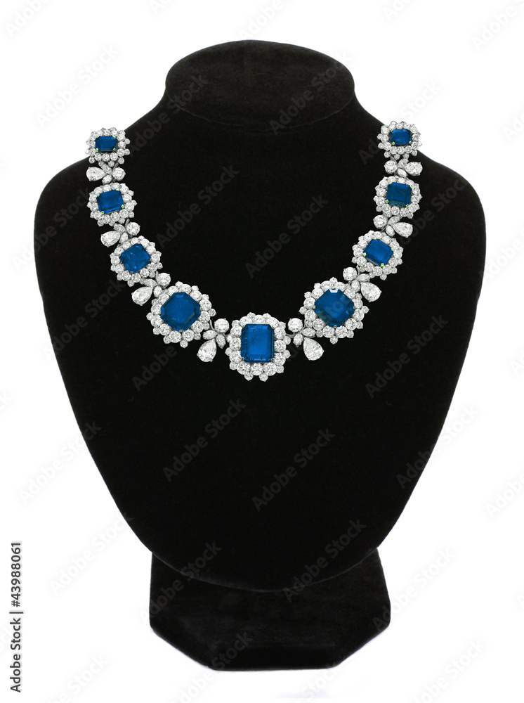 Pendant with blue gem stones on black mannequin isolated on whit Pendant with blue gem stones on black mannequin isolated on whit