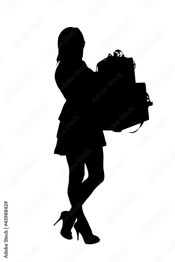 A silhouette of a full length portrait of a woman holding gifts A silhouette of a full length portrait of a woman holding gifts