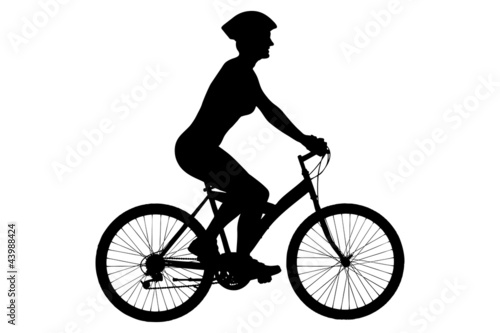 A silhouette of a female biker with helmet sitting on a bike