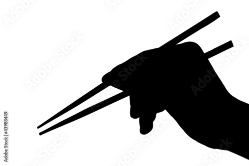 Silhouette of a hand holding chopsticks