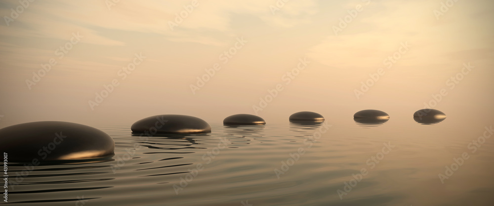 Zen path of stones on sunrise in widescreen