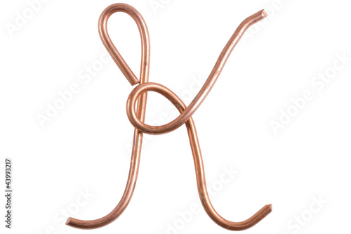 Copper metal wire in the form of letter K  modern US calligraphy