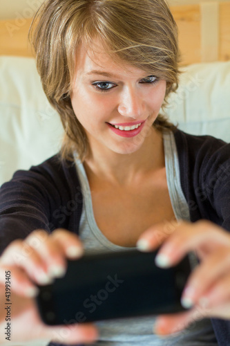 young woman taking a picture of her on the mobile