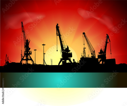 Silhouettes of port constructions on sunset