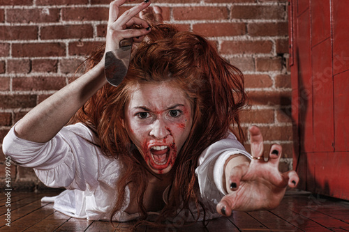 Horror Themed Image With Bleeding Freightened Woman photo