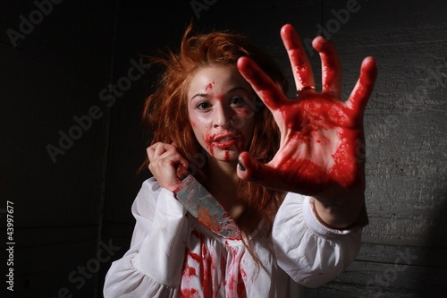 Horror Themed Image With Bleeding Freightened Woman photo