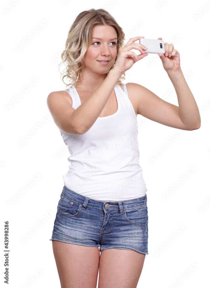 Girl posing for a photograph taken from his cell phone Girl posing for a photograph taken from his cell phone