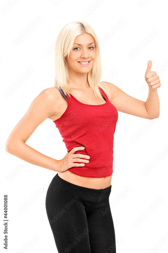 Fitness woman giving thumb up and standing in running outfit Fitness woman giving thumb up and standing in running outfit