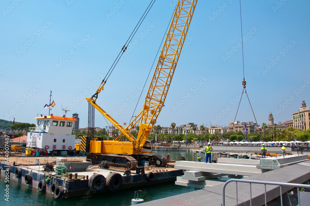 Crane working in port of Barcelona.