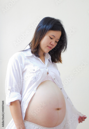Beautiful asian pregnant woman's belly