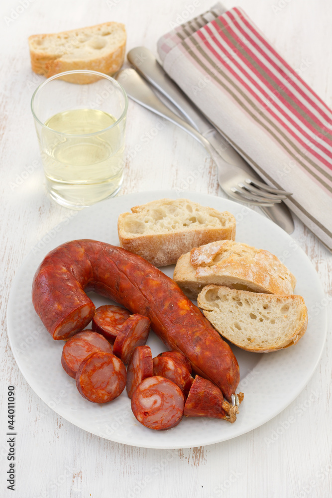 sausages with bread on the white plate sausages with bread on the white plate