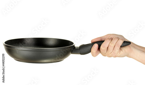 Woman's hand holding a frying pan isolated on white