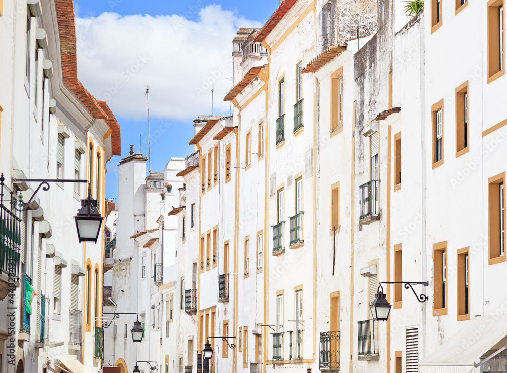 White facades old urban street in Evora. Alentejo, Portugal