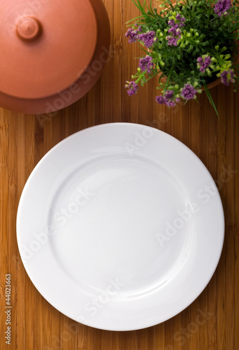 single white plate on old wood background