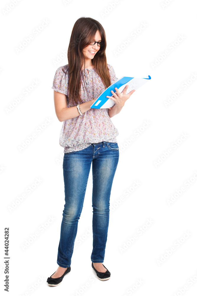 Female student reading exercise book Female student reading exercise book