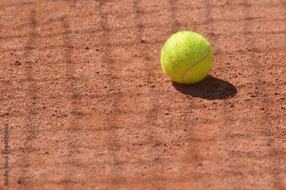 Tennis ball on the floor in a clay court