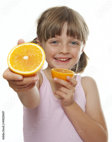 little girl with fresh orange