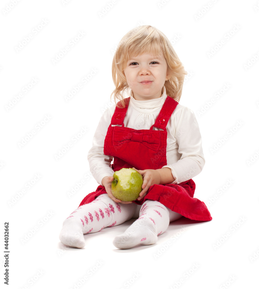 Fototapeta premium Baby girl eating apple