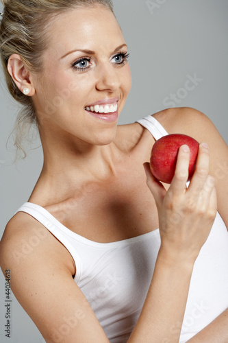 Woman eating an apple