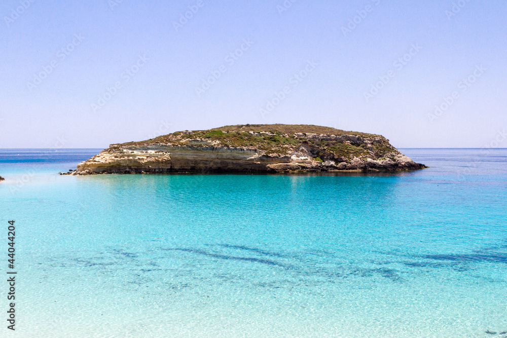 Pure crystalline water surface around an island (Lampedusa)