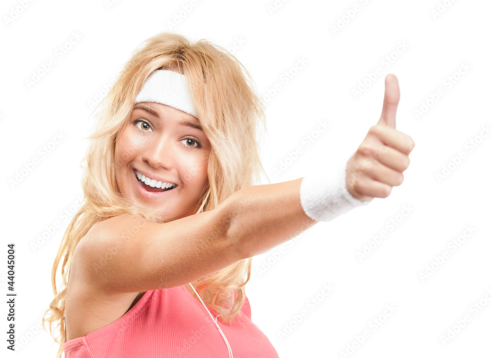 Sporty girl with thumbs up on white background. Sporty girl with thumbs up on white background.