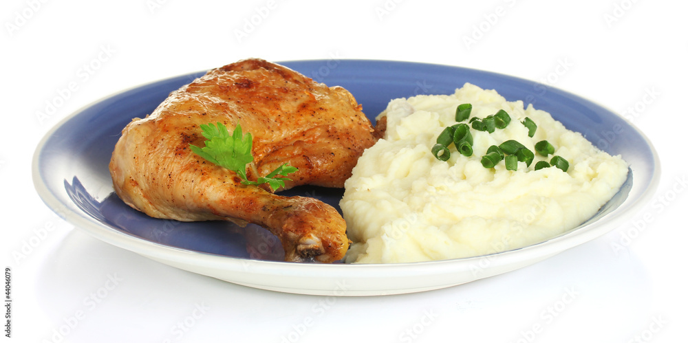 roasted chicken leg with mashed potato in the plate isolated