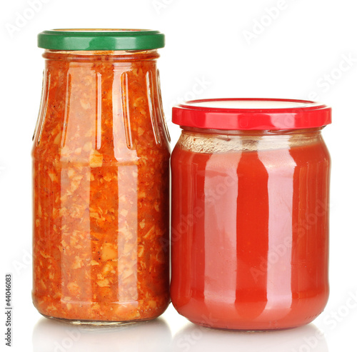 Jars with lecho and tomato paste isolated on white
