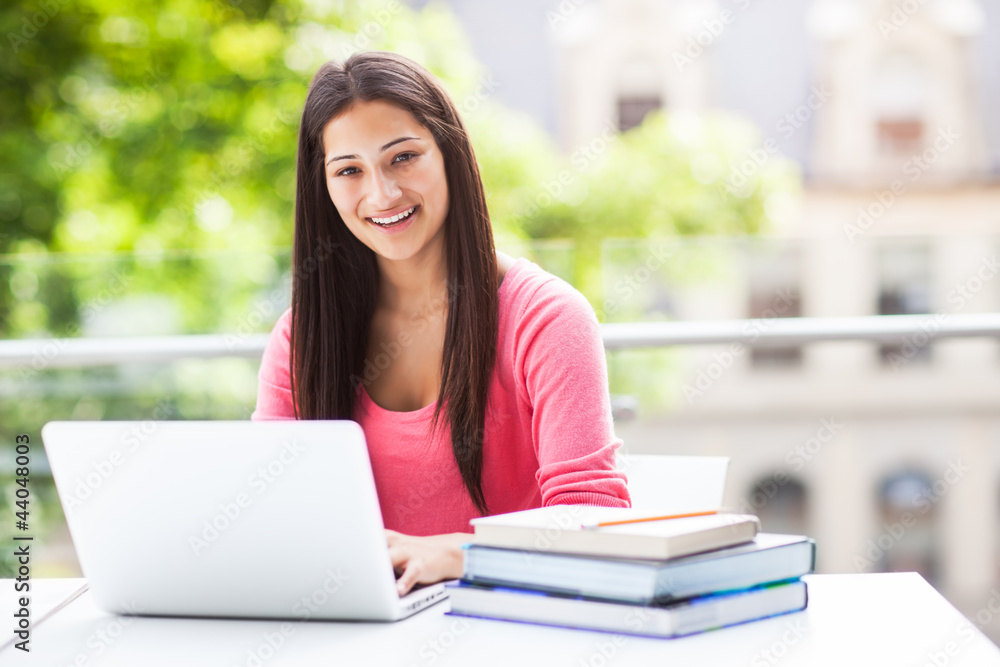 Hispanic college student with laptop Hispanic college student with laptop