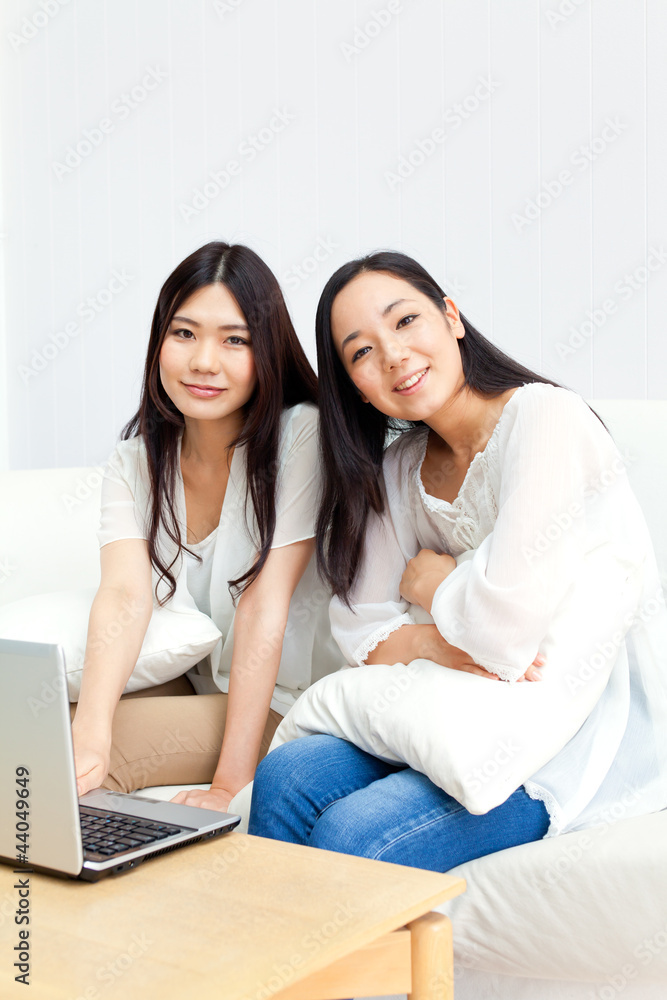 Beautiful young business women using a laptop Beautiful young business women using a laptop