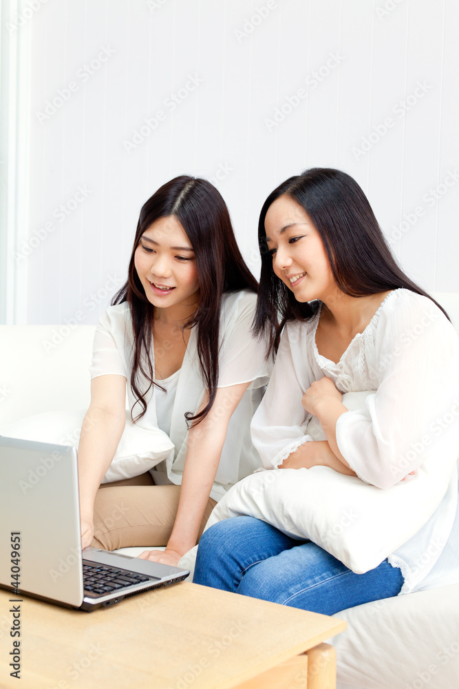 Beautiful young business women using a laptop Beautiful young business women using a laptop
