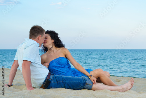 Couple kissing at the seaside