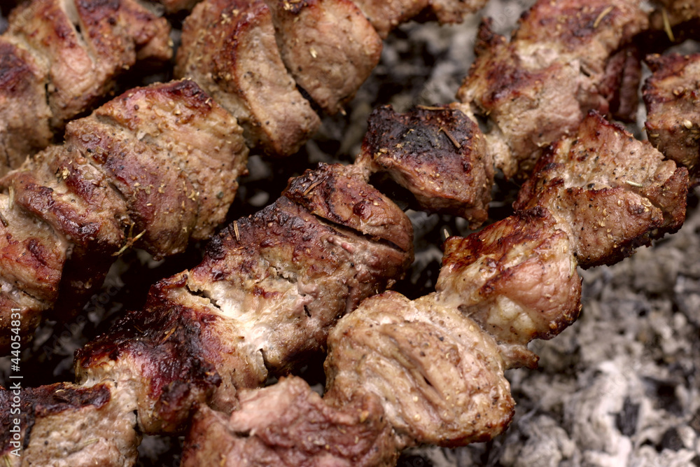 Shashlik kebab prepares on the fire outdoors Shashlik kebab prepares on the fire outdoors