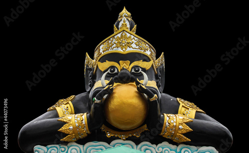 Statue of black deity called Rahu and India god with isolated. photo