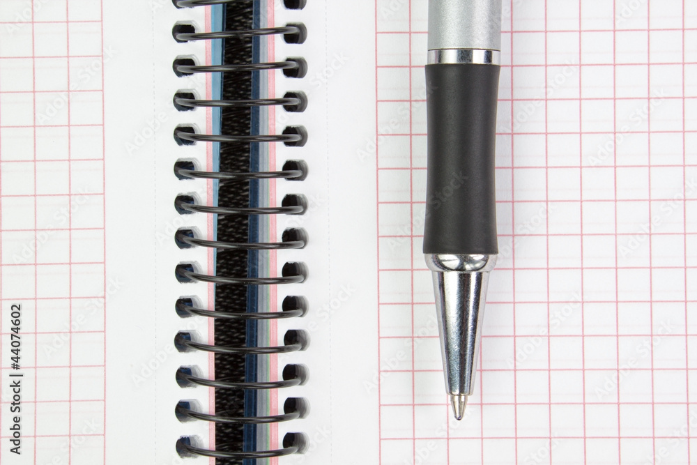 Notebook and pen closeup.