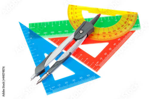 A set of rulers for the school and a compass on a white backgrou photo