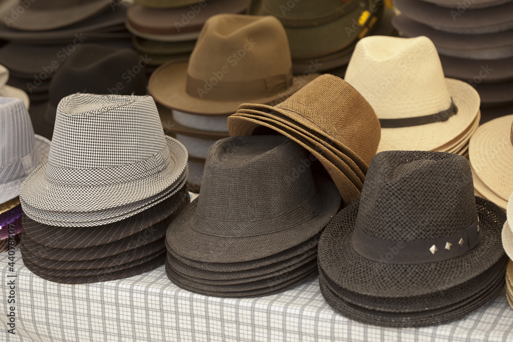 Various hat in assortment pile