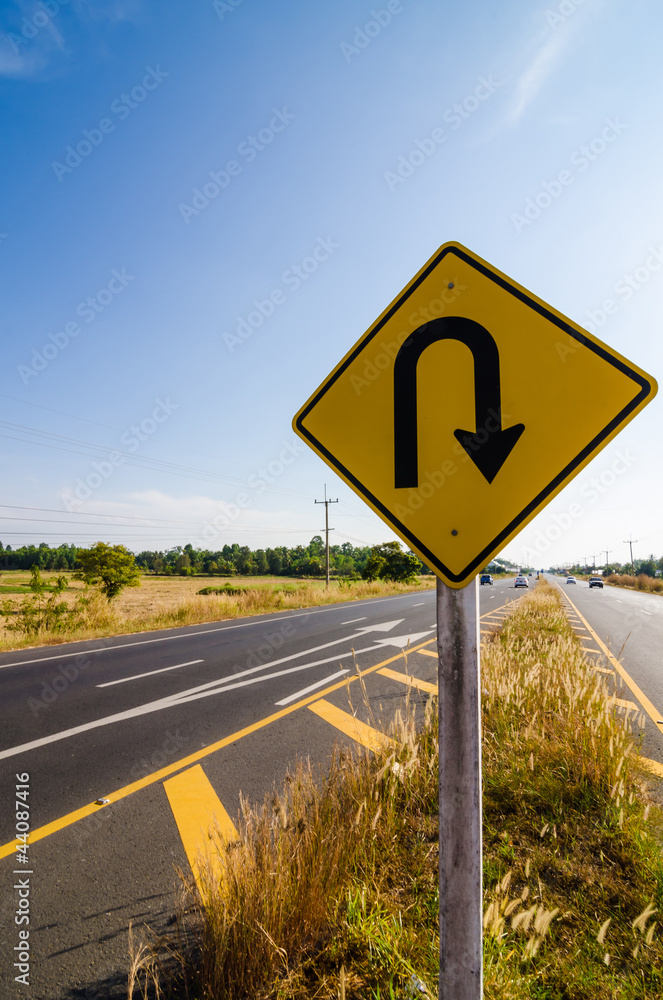 U-turn symbol Road in rustic city U-turn symbol Road in rustic city