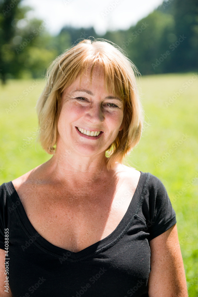 Smiling mature woman outdoor portrait