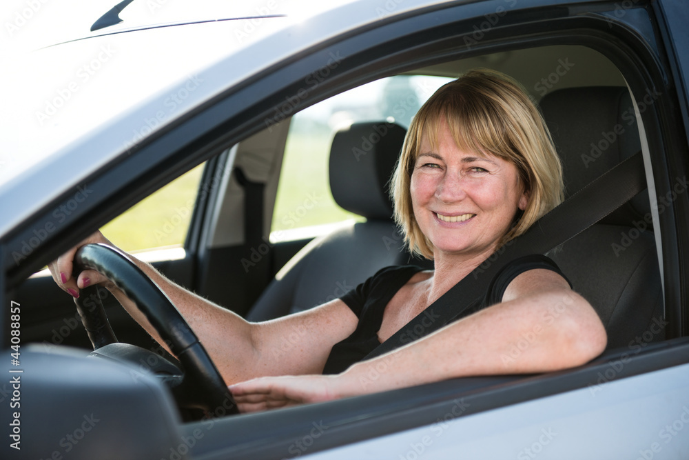 Portrait of senior woman in car