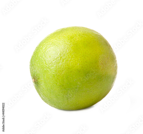 Image of green lime isolated over white background