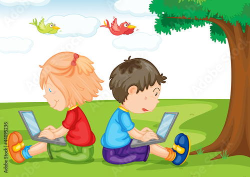 kids with laptop under a tree