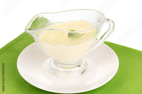 Mayonnaise in bowl on napkin isolated on white