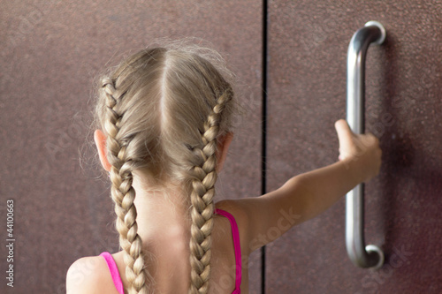 Girl open steel door