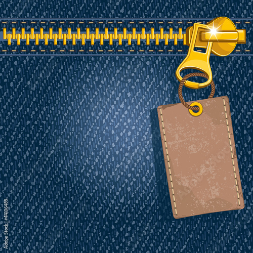 Metal zipper on denim background
