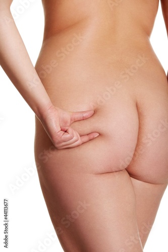 Nude woman s bottom with cellulite.