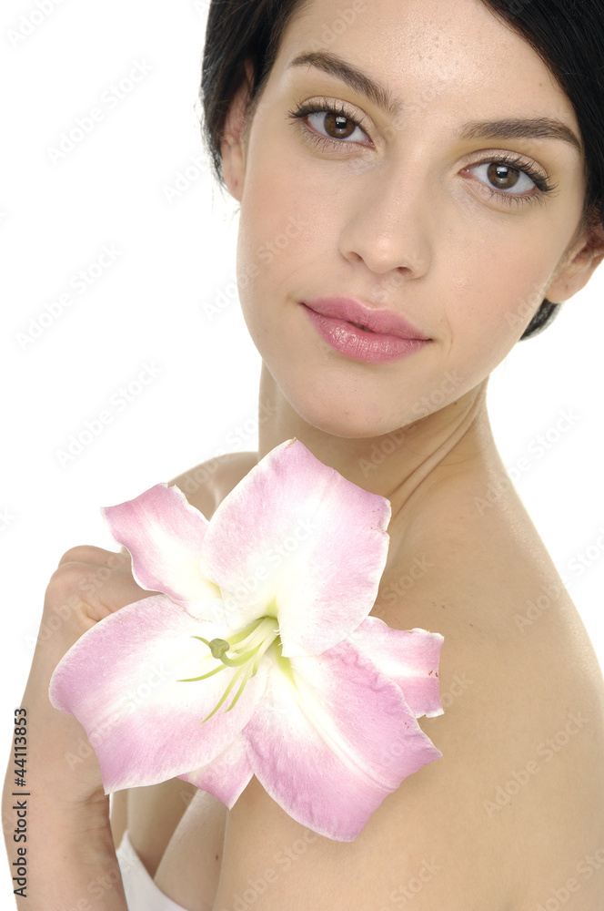 Face of young woman with pink lily Face of young woman with pink lily